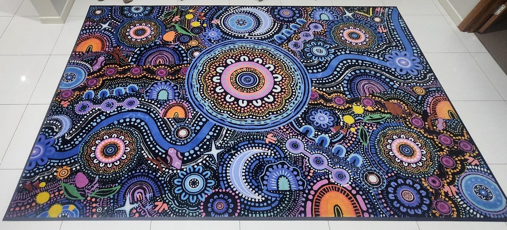Ngulawaa classroom rug by Kirsten Gray, 2m x 3m, with vibrant Indigenous design, non-slip backing and non-trip edges. Front on view. 