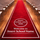 red carpet in school hall school name and crest