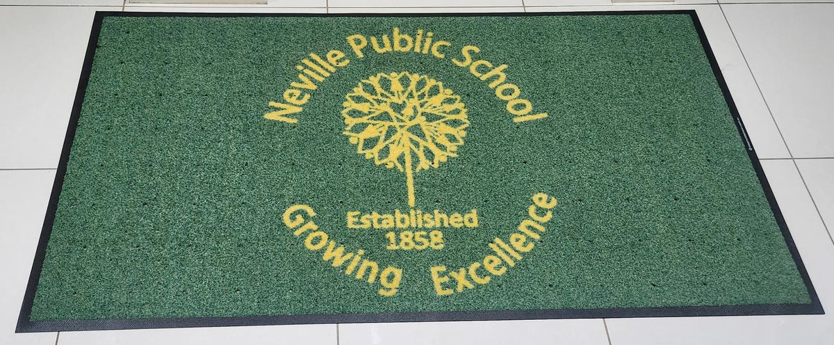 green welcome mat with yellow school logo
